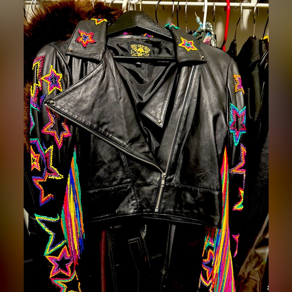 Worn inside once. Runs small. Super soft leather with multi colored fringe